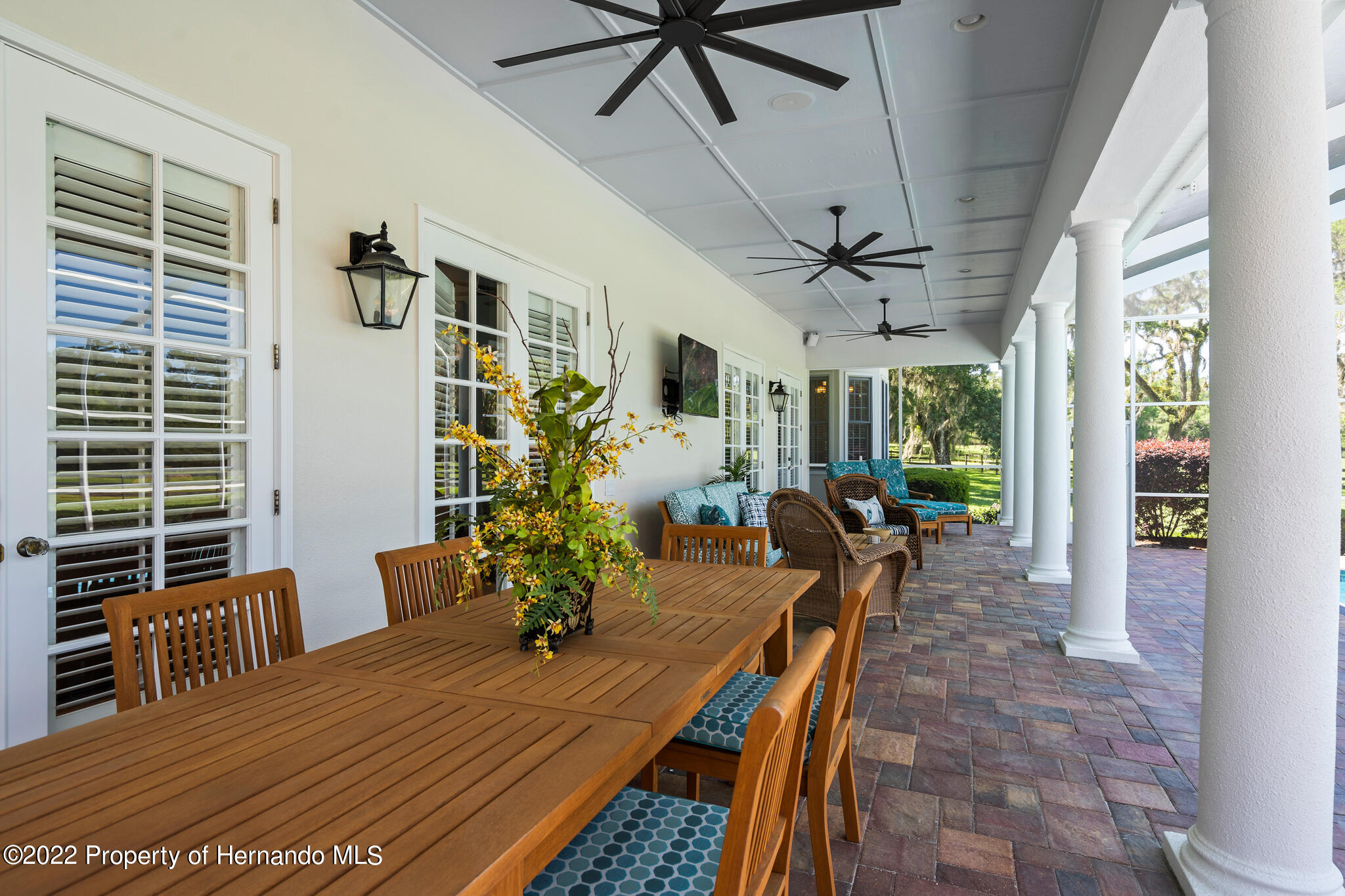 21411 Brookes Run Road Brooksville, FL 34602 - Photo 46 of 62 a view of a dining room with furniture window and wooden floor