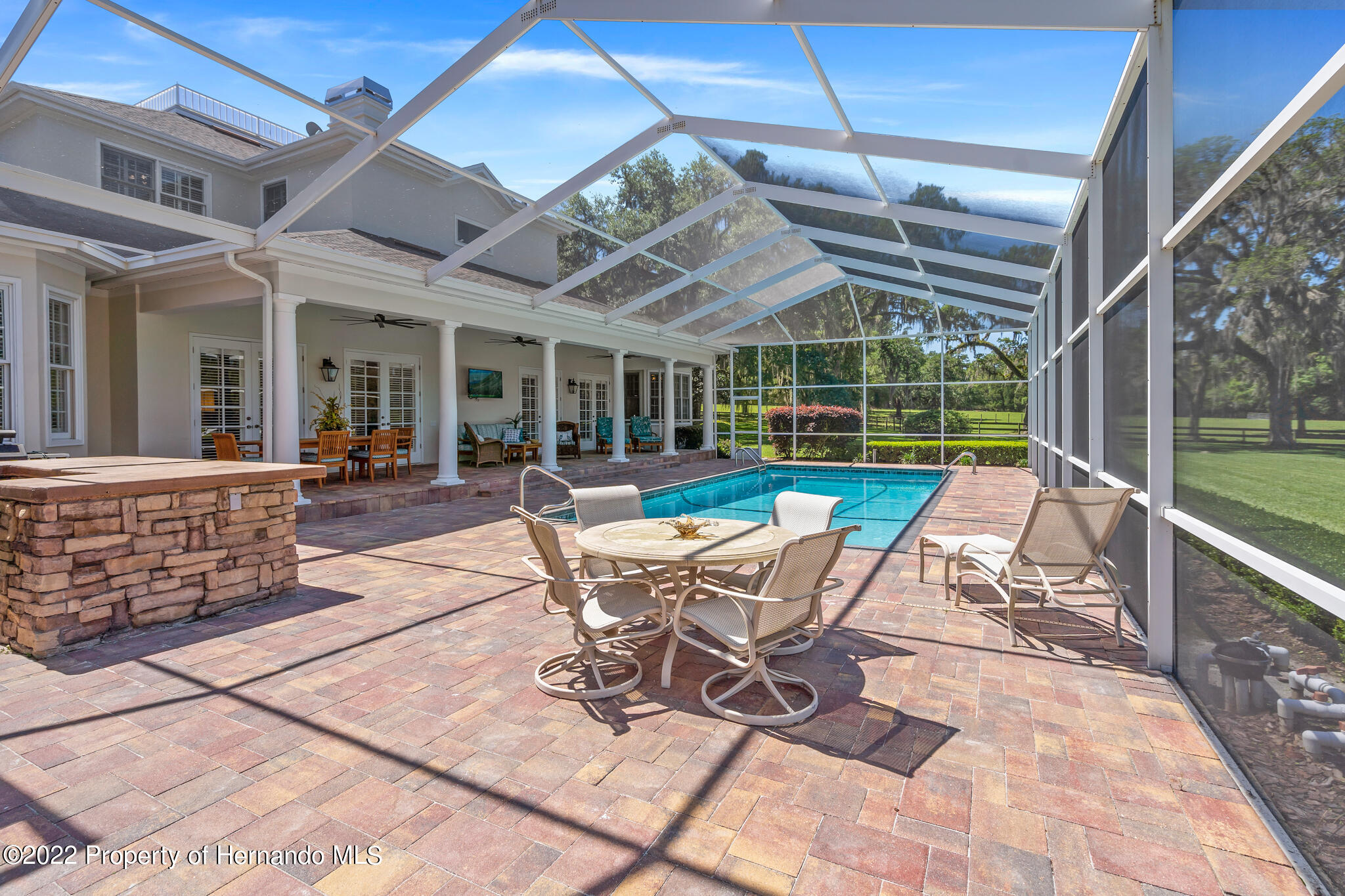 21411 Brookes Run Road Brooksville, FL 34602 - Photo 47 of 62 a patio with patio lots of furniture and garden