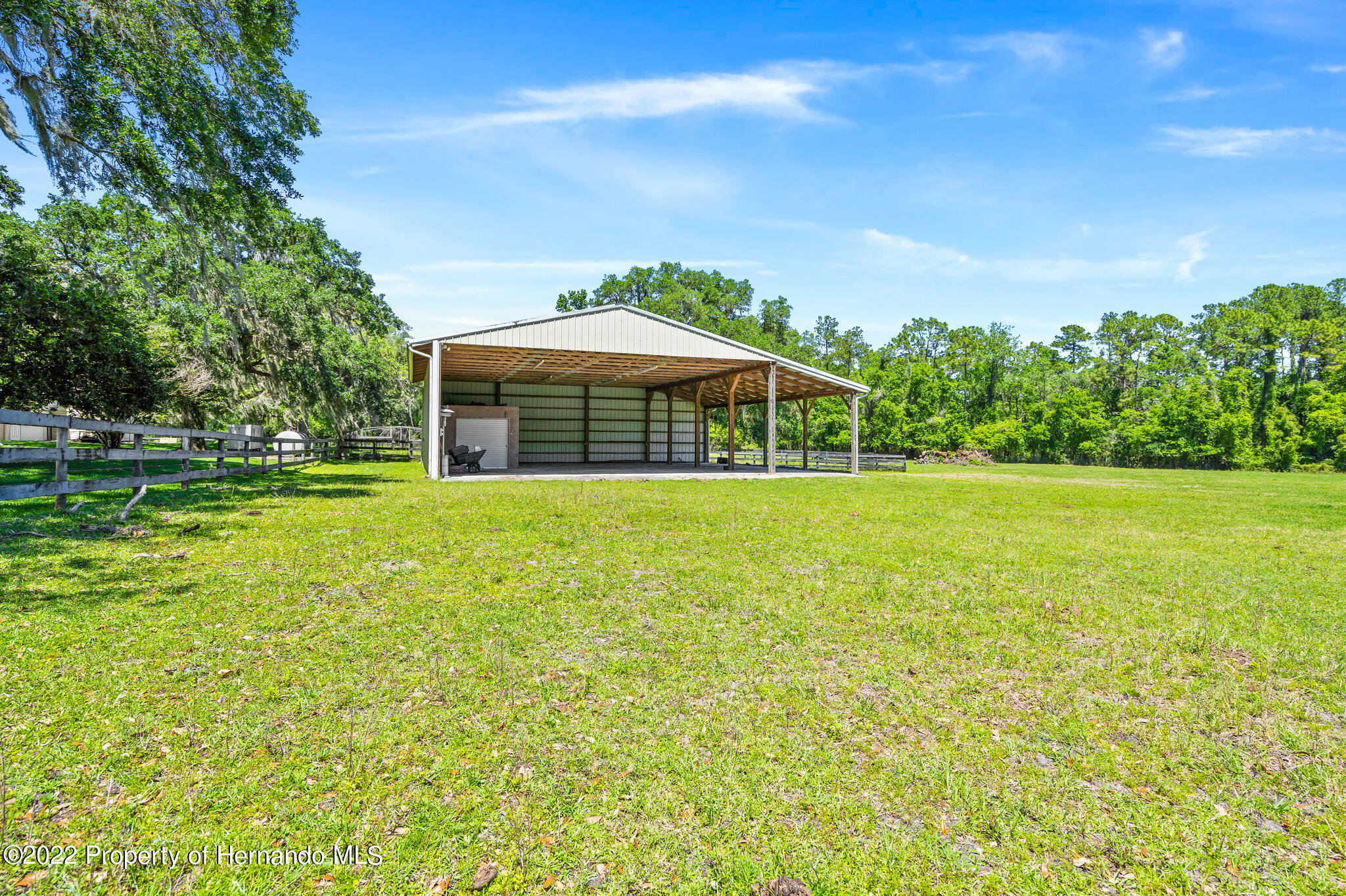 21411 Brookes Run Road Brooksville, FL 34602 - Photo 49 of 62 a view of a house with a yard