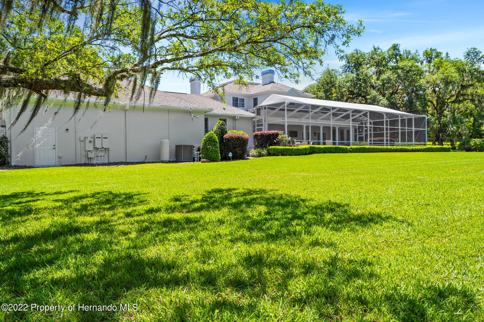 21411 Brookes Run Road Brooksville, FL 34602 - Photo 60 of 62 a front view of a house with a garden