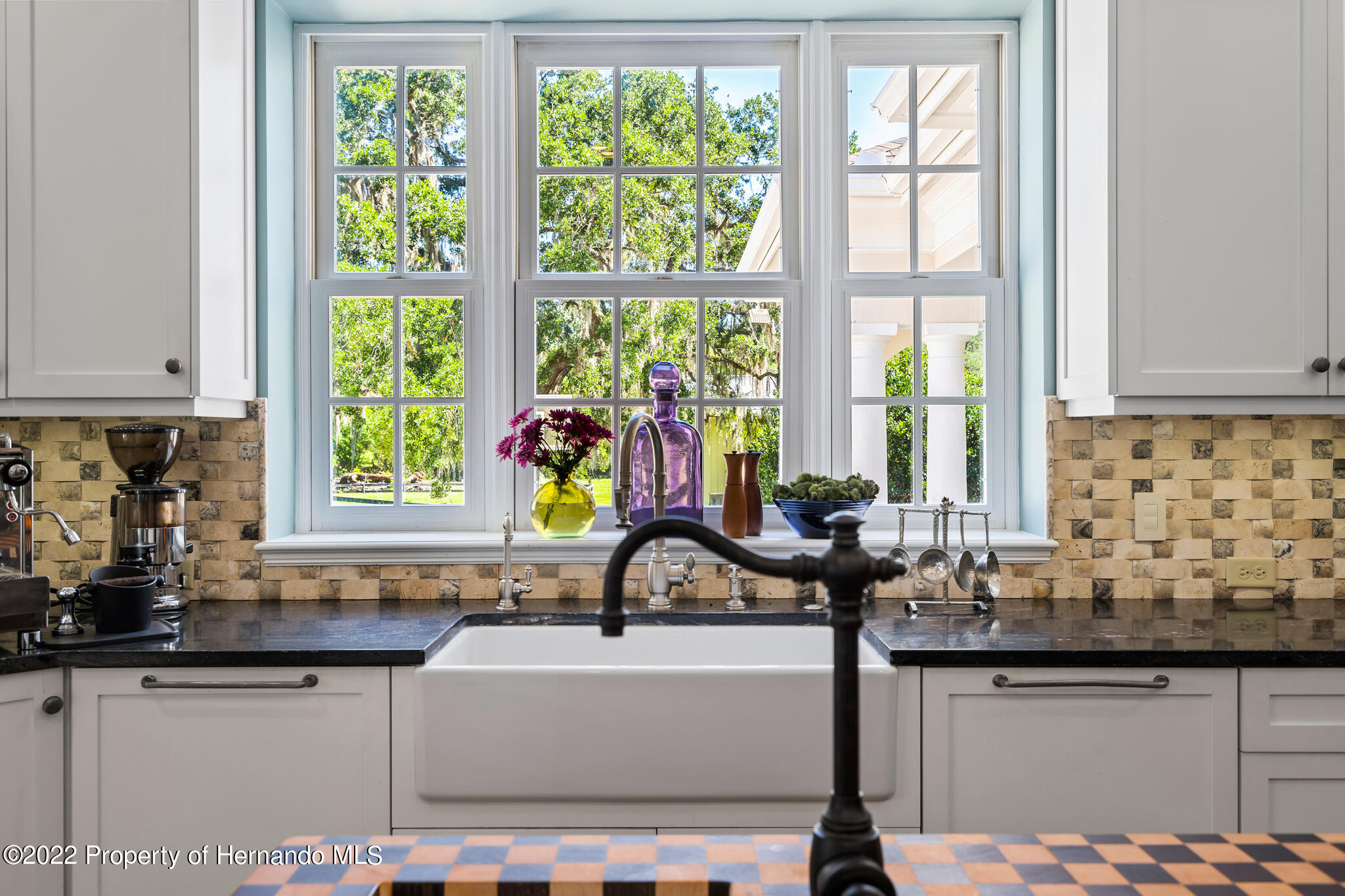 21411 Brookes Run Road Brooksville, FL 34602 - Photo 10 of 62 a counter top with granite countertop a sink a window and cabinetry