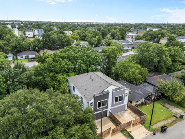 an aerial view of a house with a garden