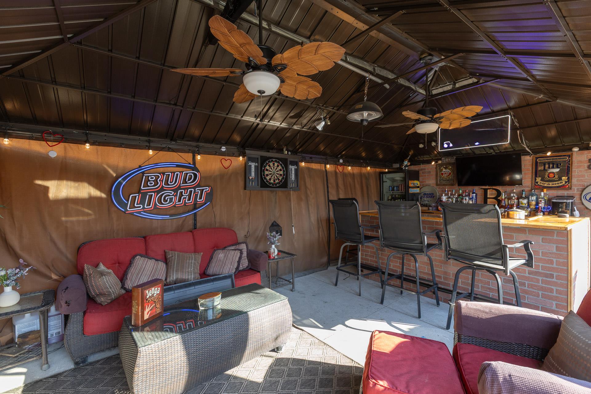 84 Riverside Avenue Mastic Beach, NY 11951 - Photo 24 of 32 View of patio with outdoor dry bar, an outdoor hangout area, and ceiling fan