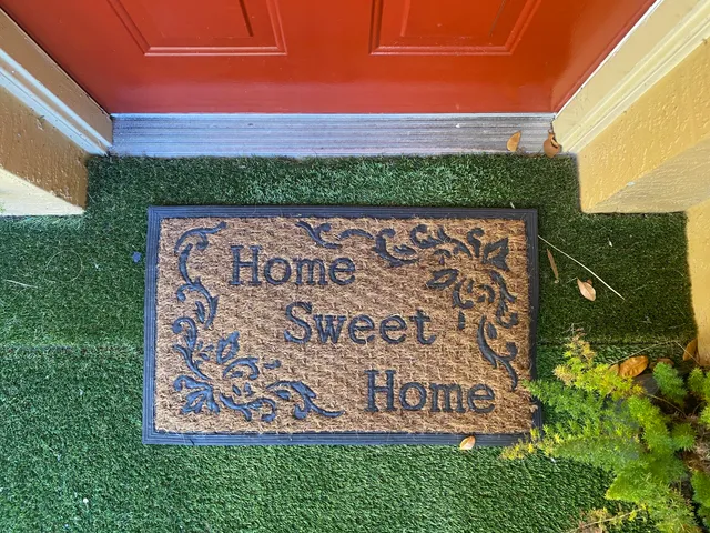 a street sign that is on a brick wall