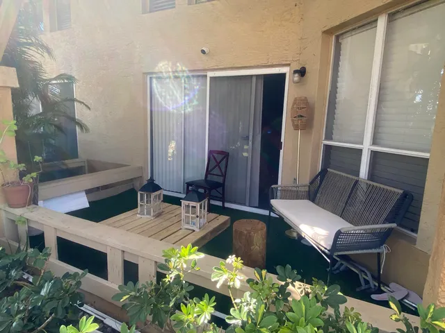 a living room with furniture and a mirror