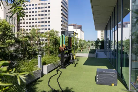 a view of a chairs and table in the balcony