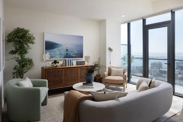 a living room with furniture and a large window