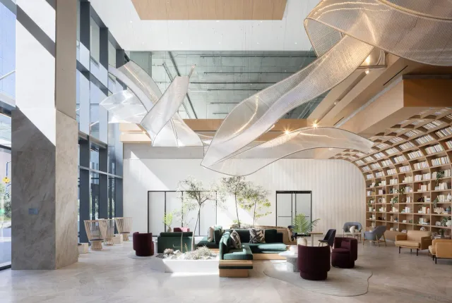 a view of a hallway with seating space