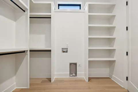 a view of a small space with wooden floor