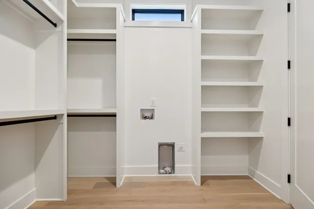 a view of a small space with wooden floor