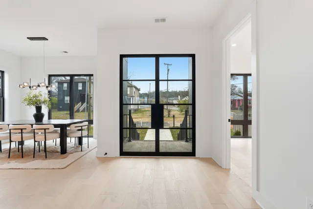 a kitchen with stainless steel appliances kitchen island granite countertop a sink and cabinets