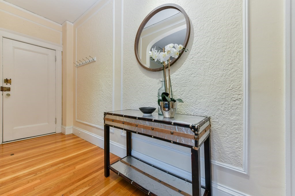 411 Washington Street, Unit 6 Brookline, MA 02446 - Photo 15 of 32 a view of a room with a table and a mirror