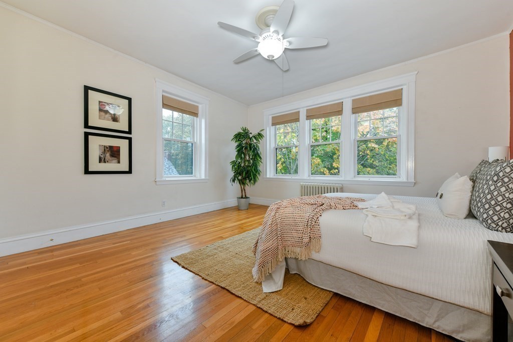 411 Washington Street, Unit 6 Brookline, MA 02446 - Photo 18 of 32 a living room with a bed furniture and a large window