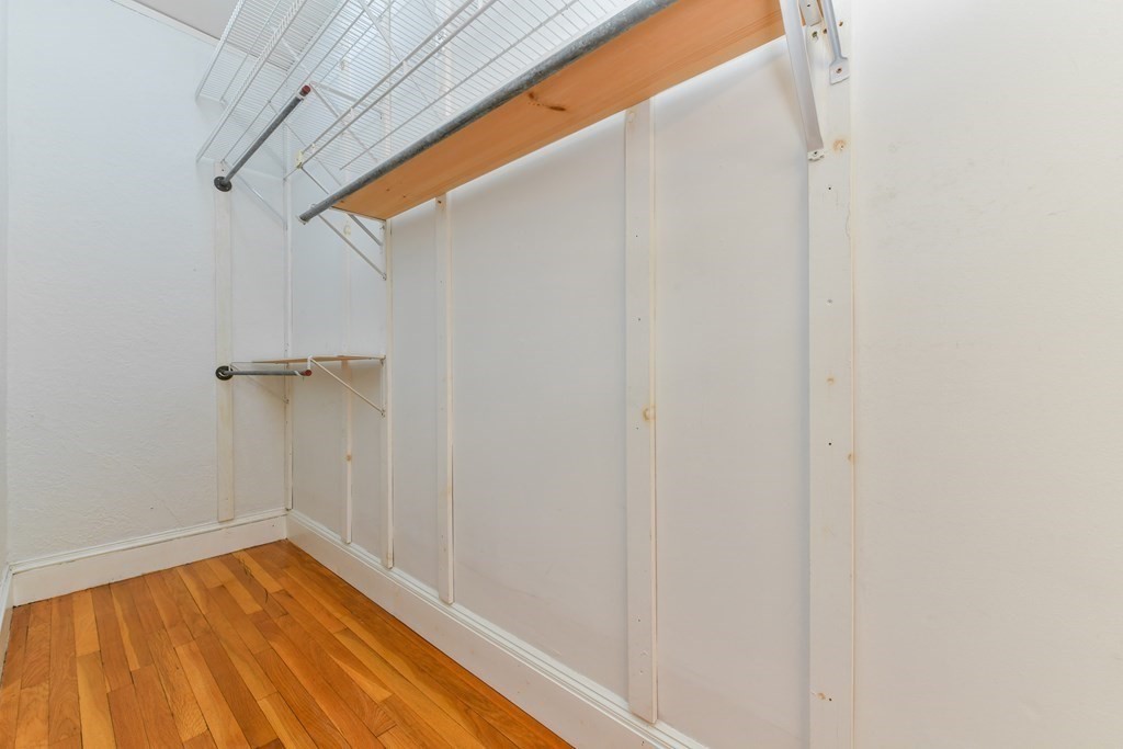 411 Washington Street, Unit 6 Brookline, MA 02446 - Photo 21 of 32 a view of a room with wooden floor and bench