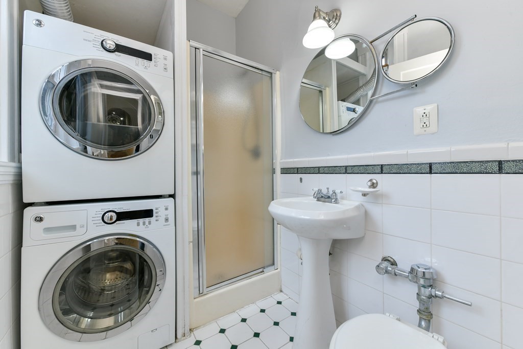 411 Washington Street, Unit 6 Brookline, MA 02446 - Photo 26 of 32 a bathroom with a sink mirror and toilet