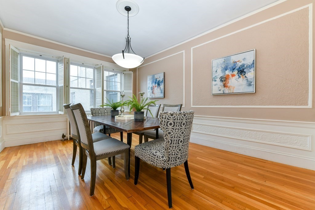 411 Washington Street, Unit 6 Brookline, MA 02446 - Photo 8 of 32 a view of a dining room with furniture window and wooden floor