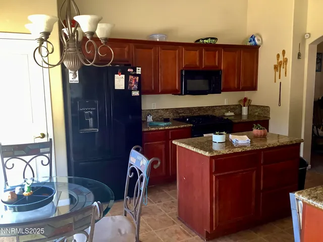 a kitchen with a stove and a refrigerator