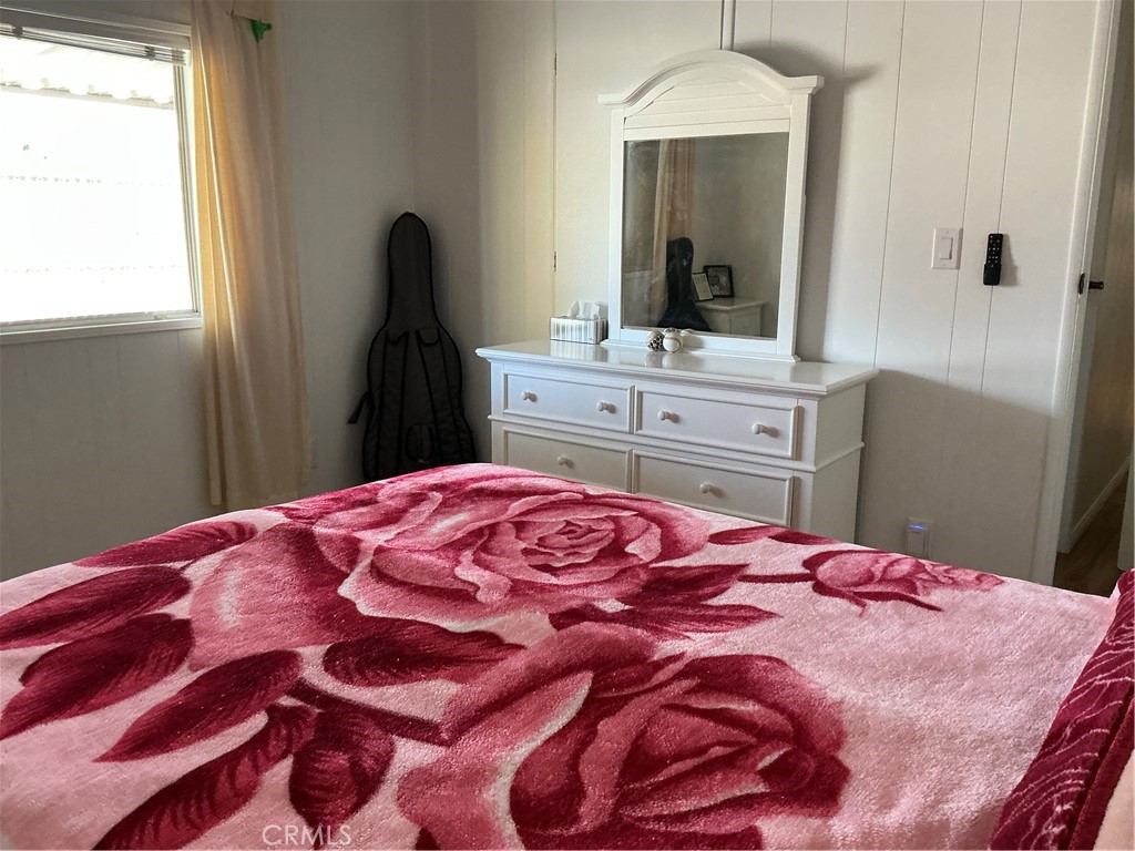 17625 Langlois Road, Unit SPACE 13 Desert Hot Springs, CA 92241 - Photo 12 of 47 a bedroom with a bed and a mirror on dresser