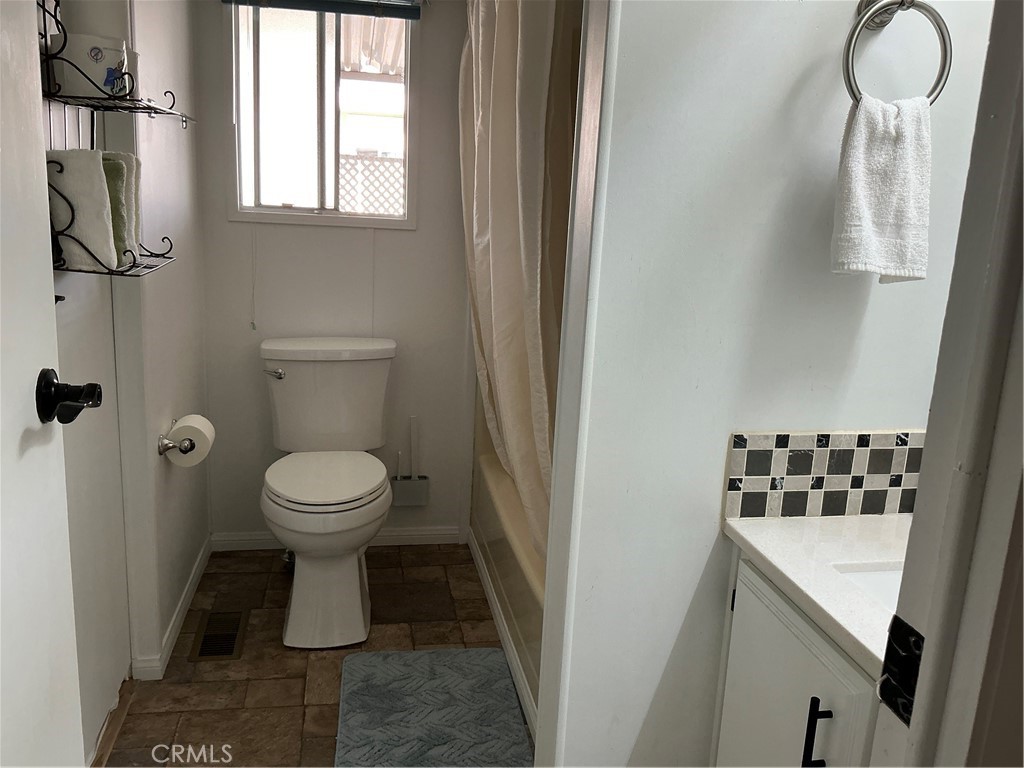 17625 Langlois Road, Unit SPACE 13 Desert Hot Springs, CA 92241 - Photo 14 of 47 a bathroom with a toilet and a sink