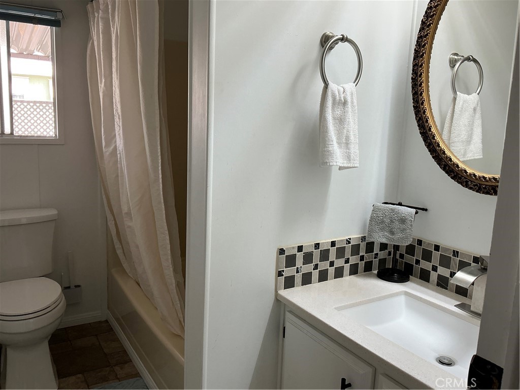 17625 Langlois Road, Unit SPACE 13 Desert Hot Springs, CA 92241 - Photo 15 of 47 a bathroom with a sink and a mirror