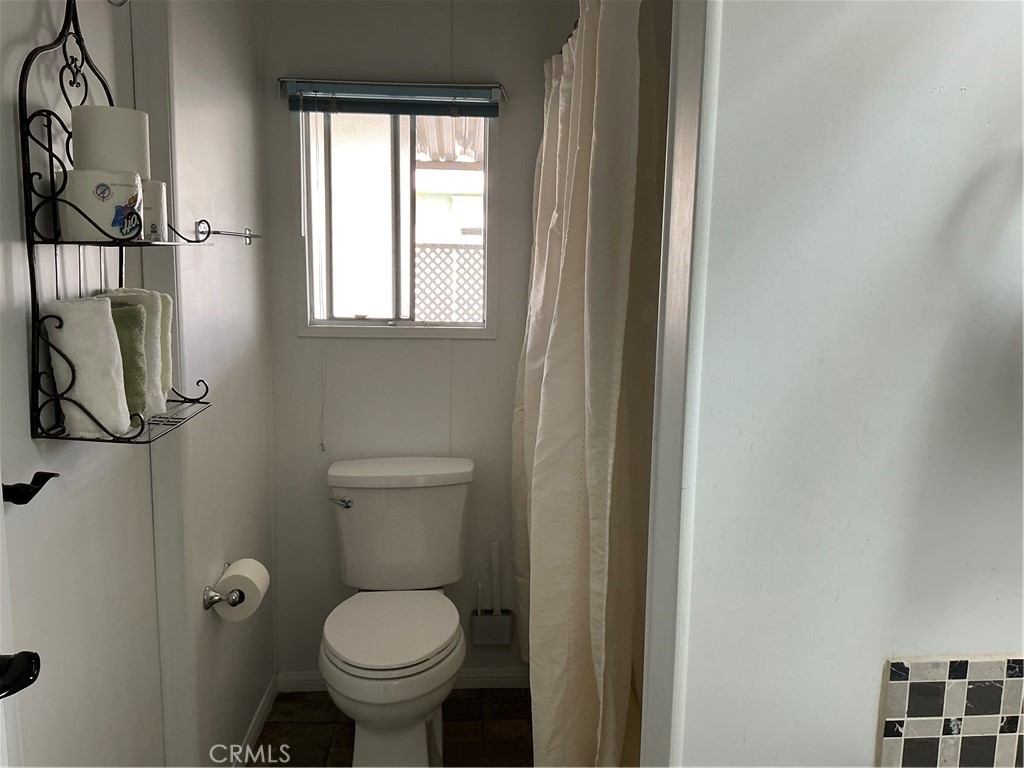 17625 Langlois Road, Unit SPACE 13 Desert Hot Springs, CA 92241 - Photo 16 of 47 a bathroom with a toilet and a sink