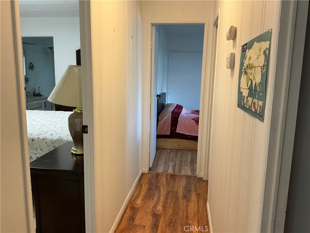 17625 Langlois Road, Unit SPACE 13 Desert Hot Springs, CA 92241 - Photo 17 of 47 a view of a hallway with wooden floor and closet