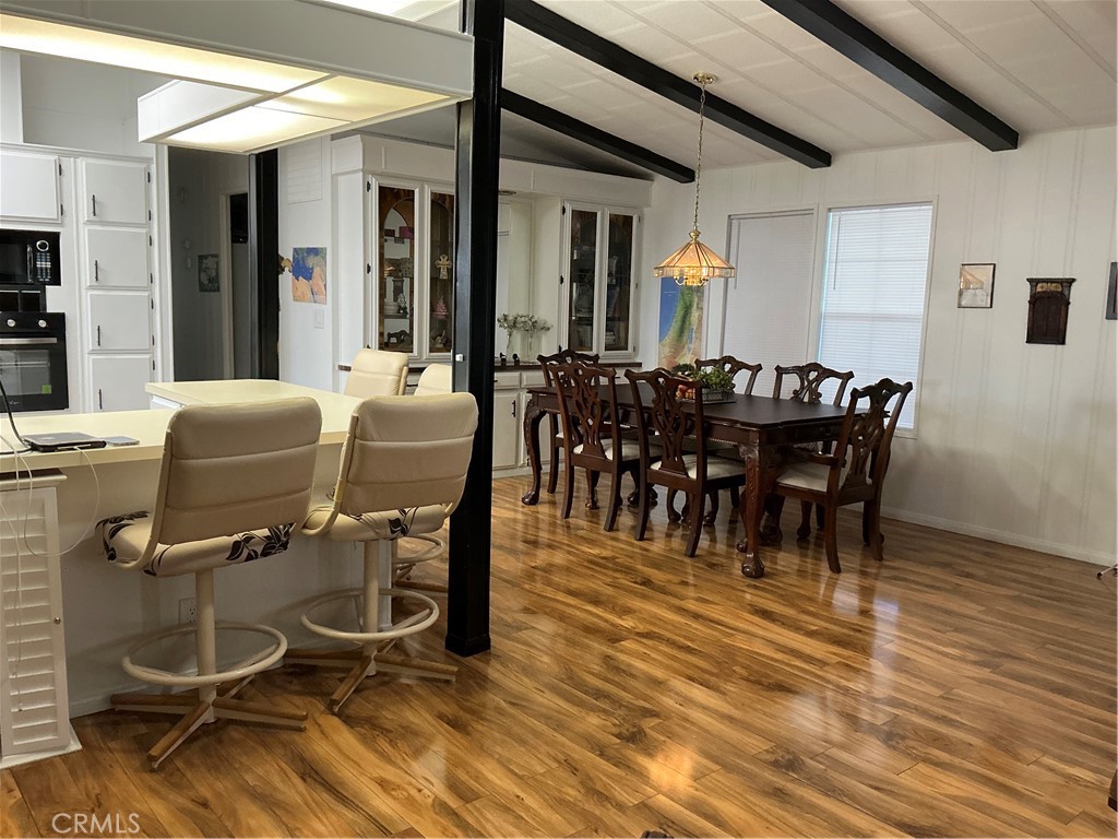 17625 Langlois Road, Unit SPACE 13 Desert Hot Springs, CA 92241 - Photo 20 of 47 a dining room with furniture and wooden floor