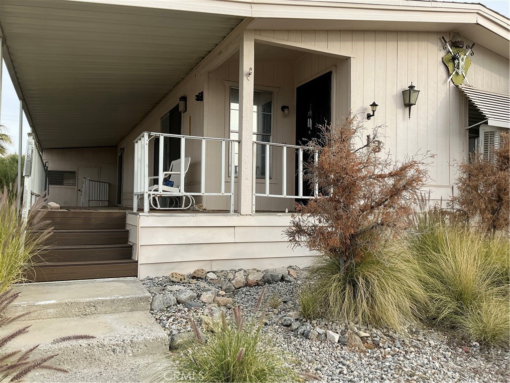 17625 Langlois Road, Unit SPACE 13 Desert Hot Springs, CA 92241 - Photo 36 of 47 a view of house with stairs yard and seating area