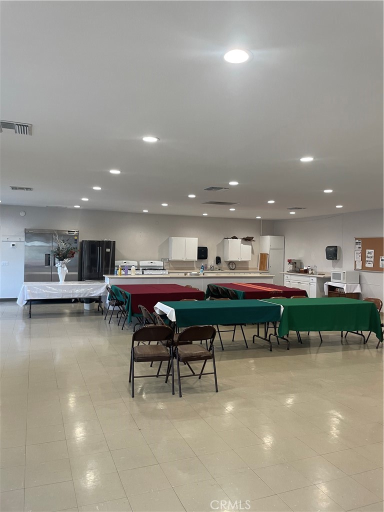 17625 Langlois Road, Unit SPACE 13 Desert Hot Springs, CA 92241 - Photo 40 of 47 a kitchen with a table and chairs in it