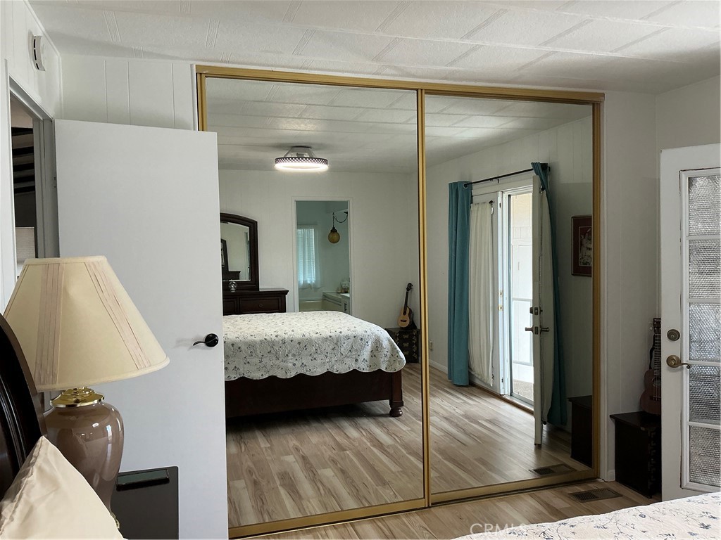 17625 Langlois Road, Unit SPACE 13 Desert Hot Springs, CA 92241 - Photo 4 of 47 a bedroom with a bed and a mirror