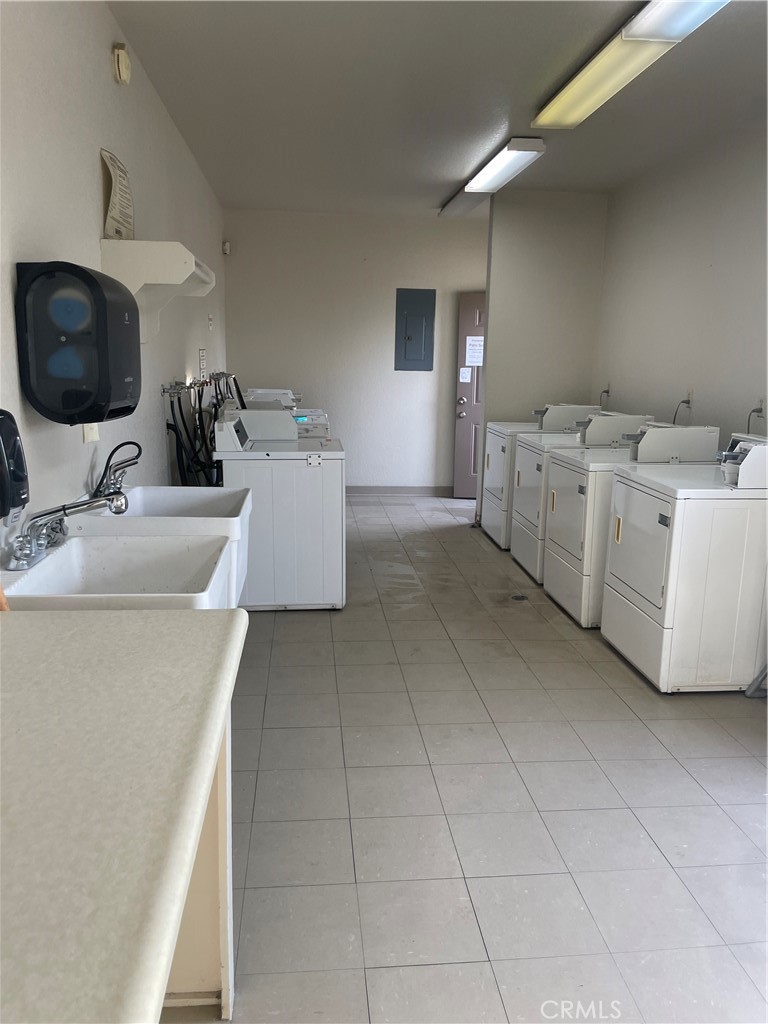 17625 Langlois Road, Unit SPACE 13 Desert Hot Springs, CA 92241 - Photo 45 of 47 a kitchen with a sink and a stove top oven