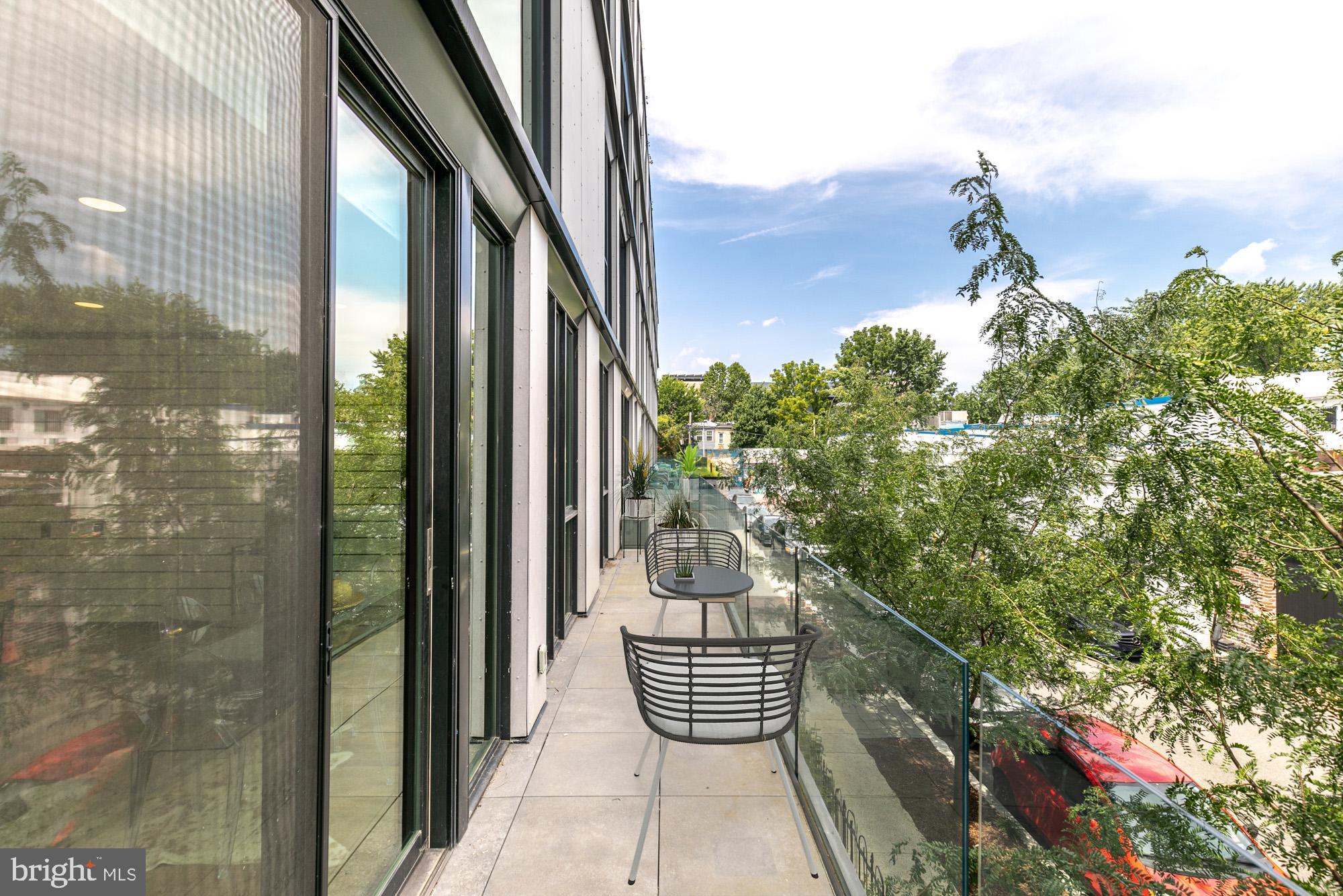 57 N Street Northwest, Unit 225 Washington, DC 20001 - Photo 2 of 26 AMAZING balcony that runs the length of the condo.
