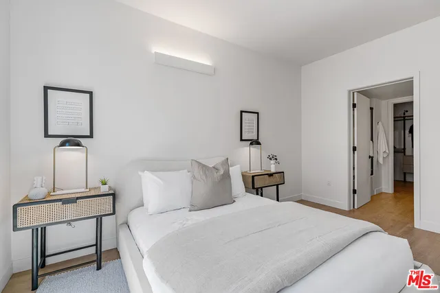 a bedroom with a bed and a table