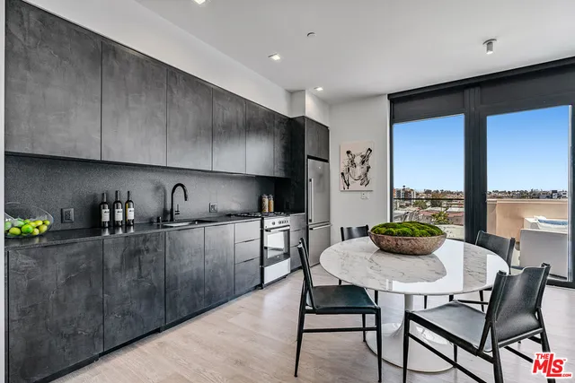 a kitchen with a table and chairs in it