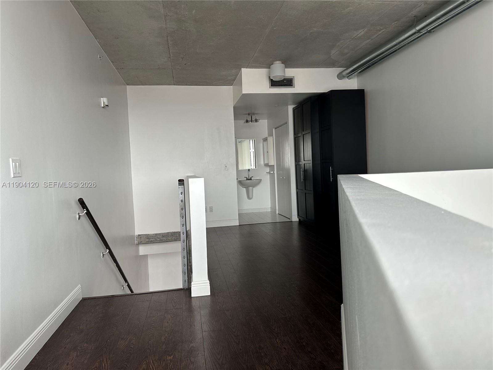 690 Southwest 1st Court, Unit 1211 Miami, FL 33130 - Photo 18 of 23 a view of a hallway with workspace