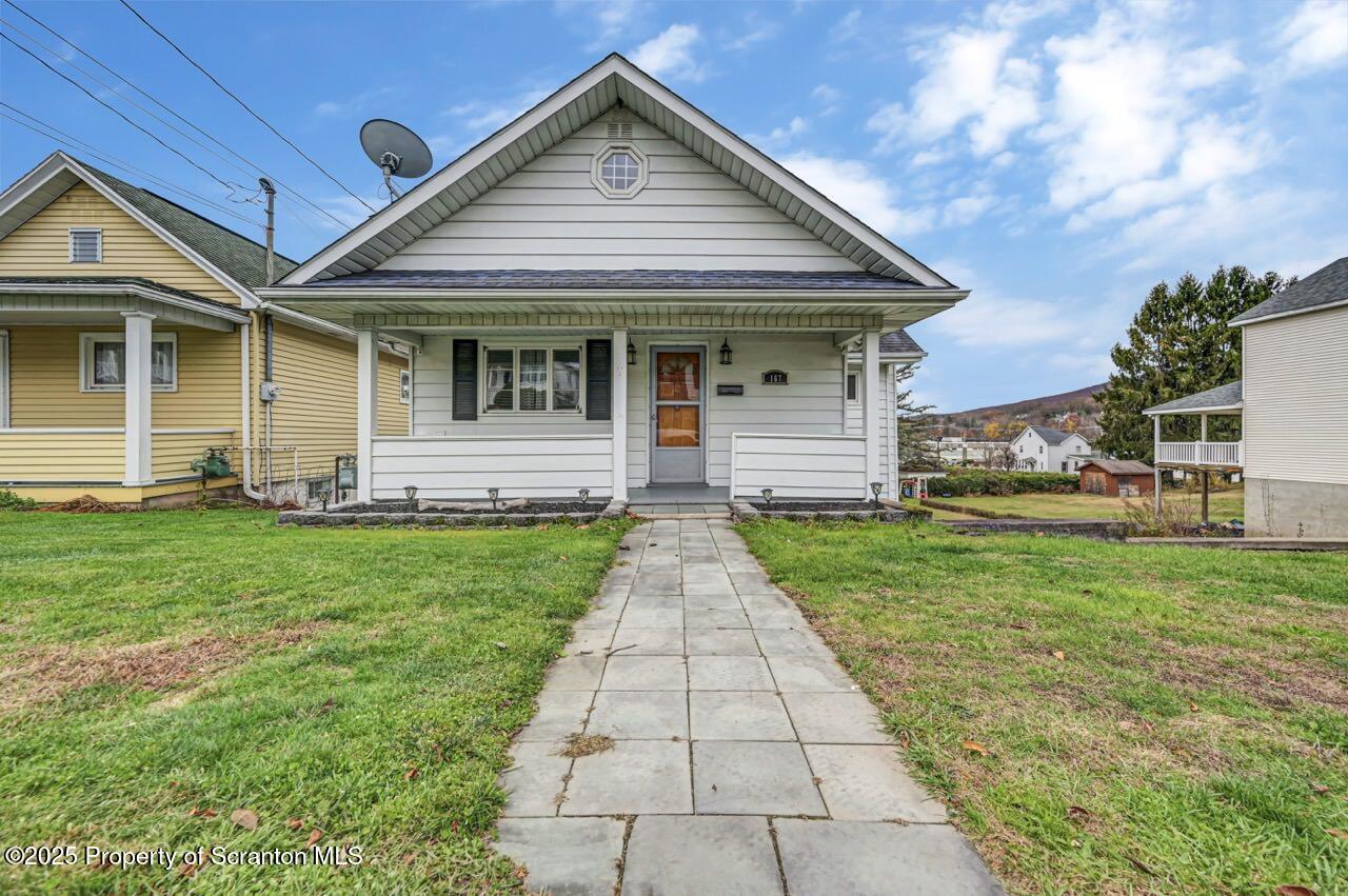 167 Handley Street Eynon, PA 18403 - Photo 1 of 48 a front view of a house with garden