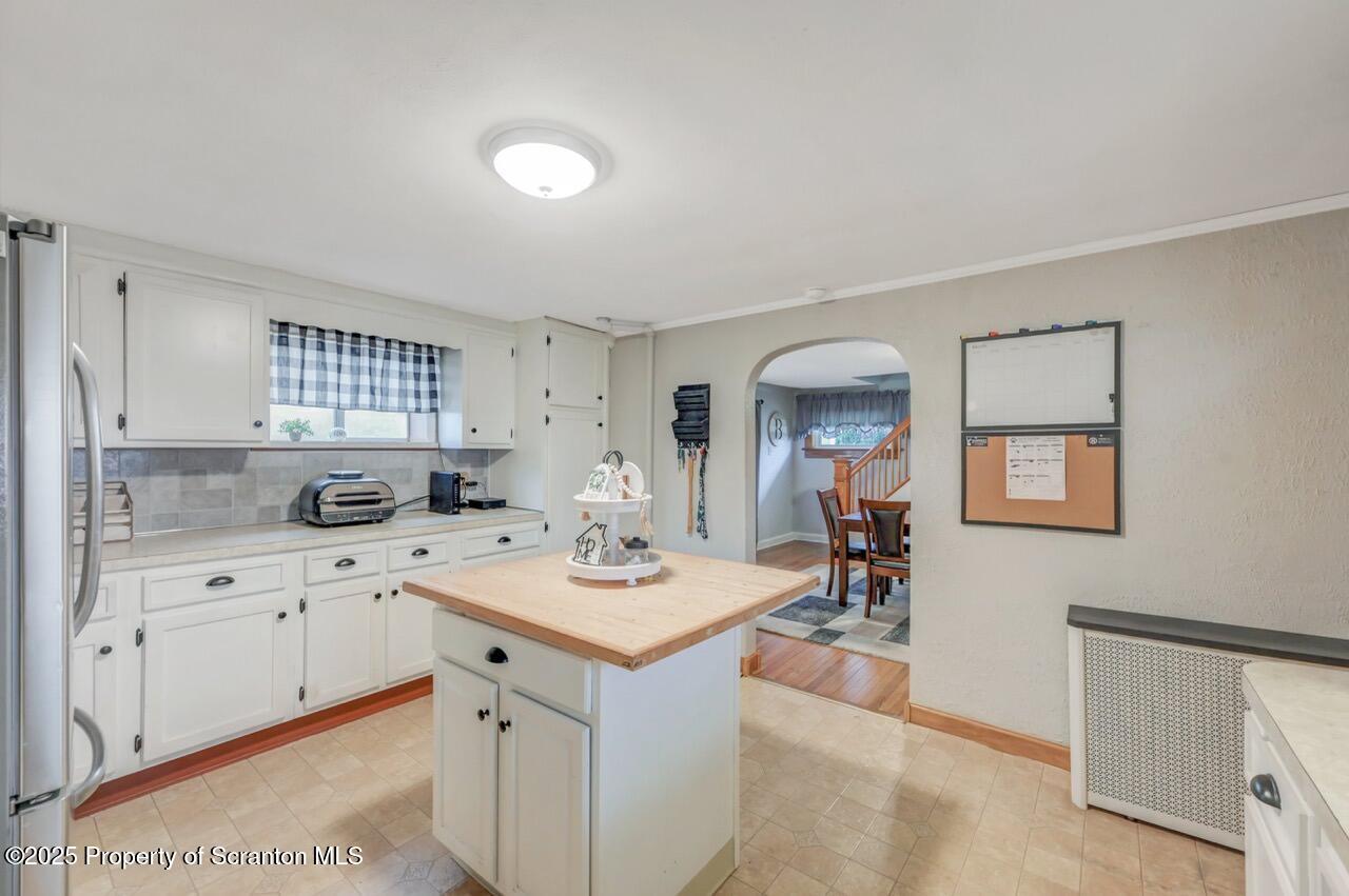 167 Handley Street Eynon, PA 18403 - Photo 16 of 48 a kitchen with a sink a stove and cabinets