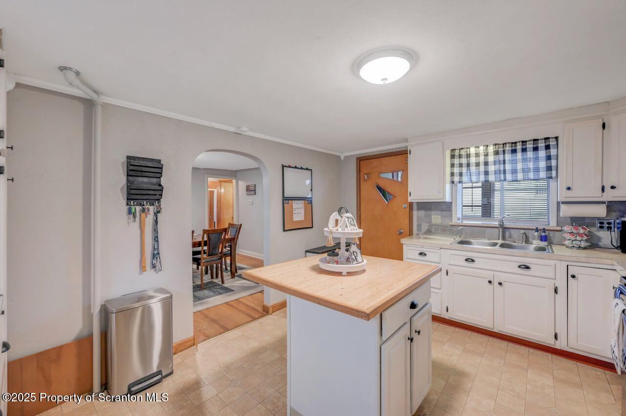 167 Handley Street Eynon, PA 18403 - Photo 17 of 48 a kitchen with a sink stove and cabinets