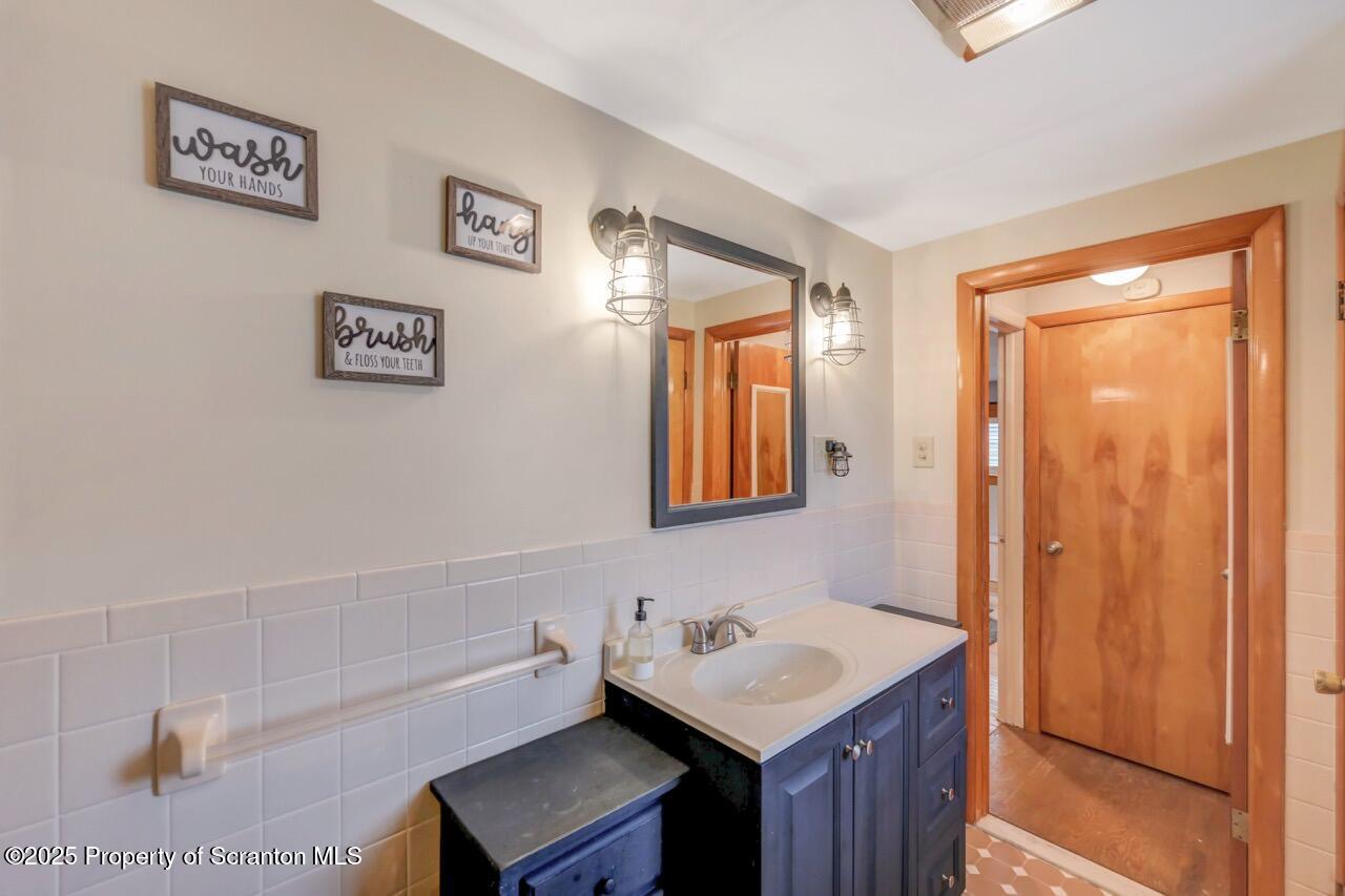 167 Handley Street Eynon, PA 18403 - Photo 21 of 48 a bathroom with a sink a toilet and shower