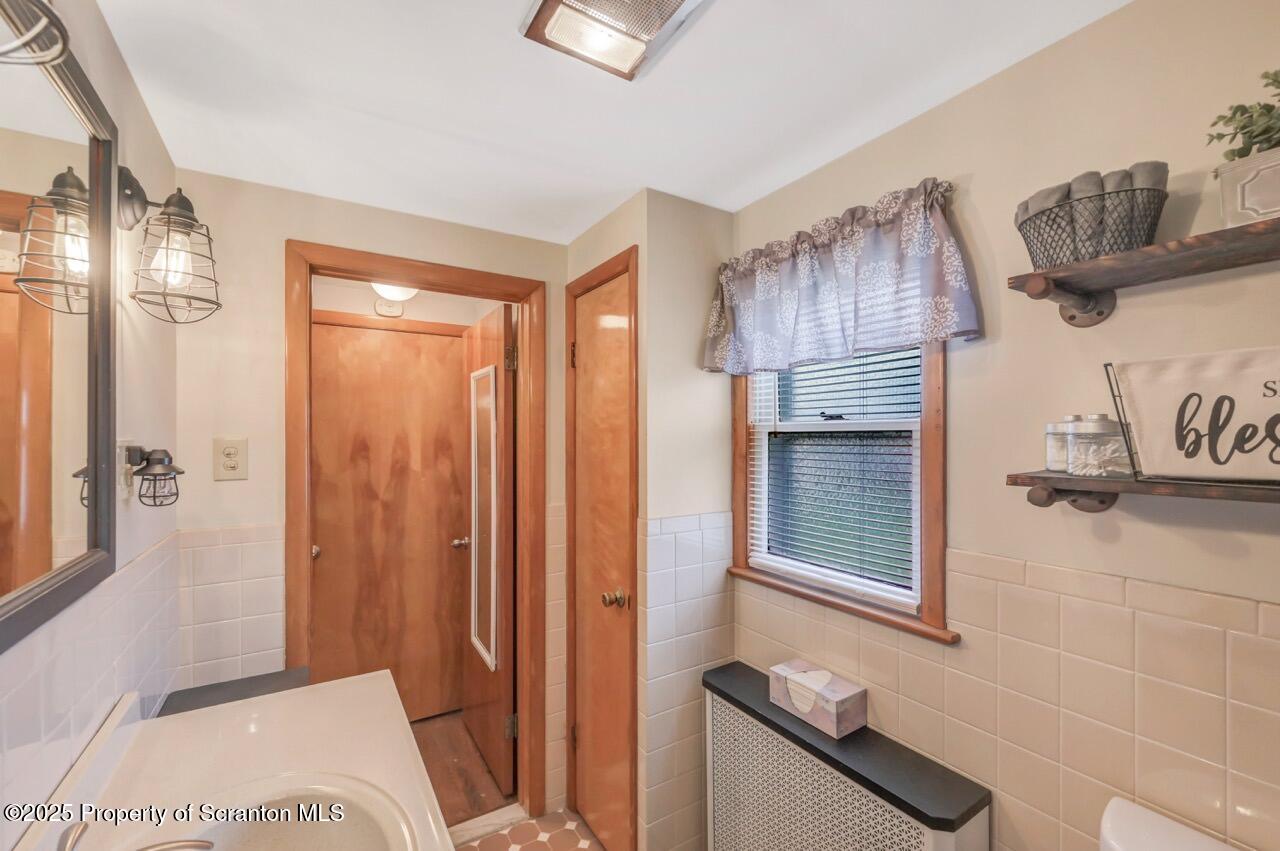 167 Handley Street Eynon, PA 18403 - Photo 22 of 48 a bedroom with a bed and a dresser