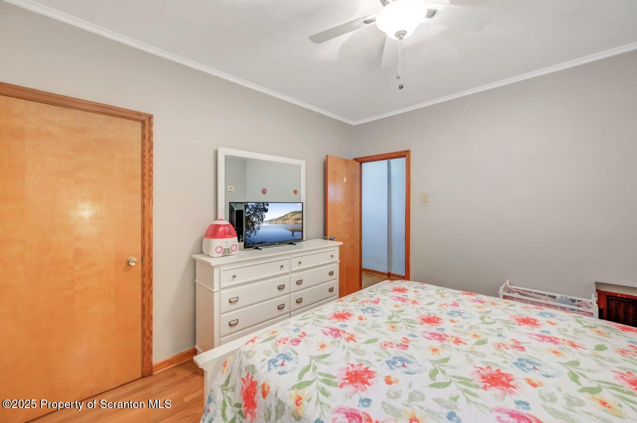 167 Handley Street Eynon, PA 18403 - Photo 26 of 48 a bedroom with a bed and a dresser in it