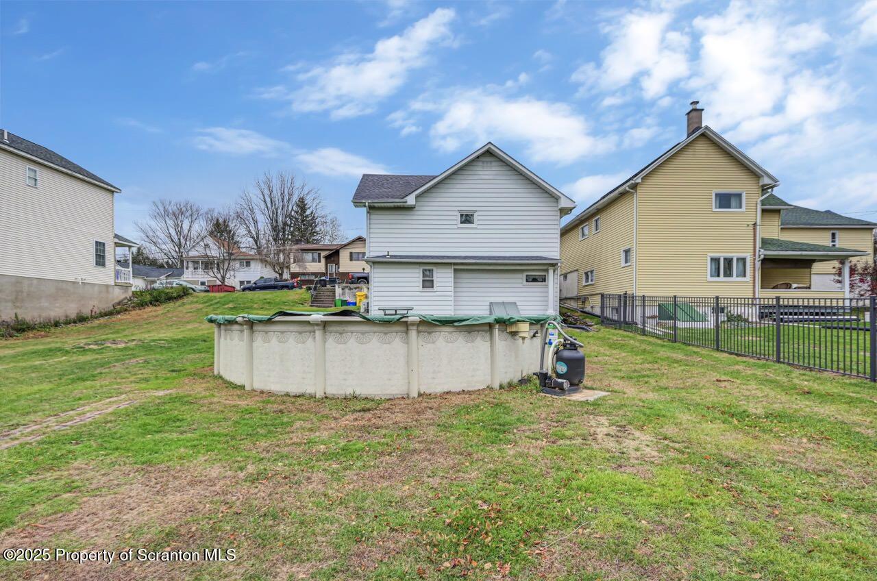 167 Handley Street Eynon, PA 18403 - Photo 46 of 48 a view of a house with pool and a yard