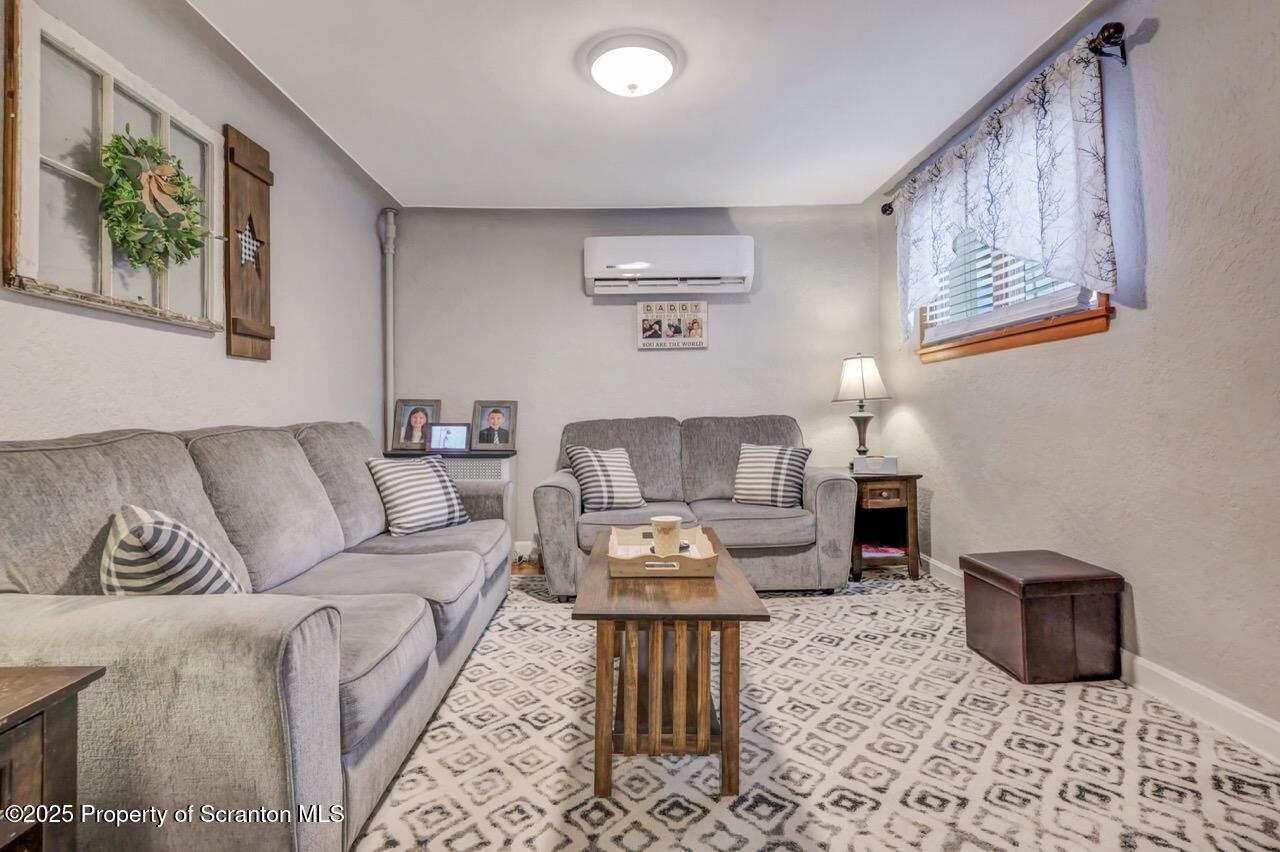 167 Handley Street Eynon, PA 18403 - Photo 5 of 48 a living room with furniture and a couch