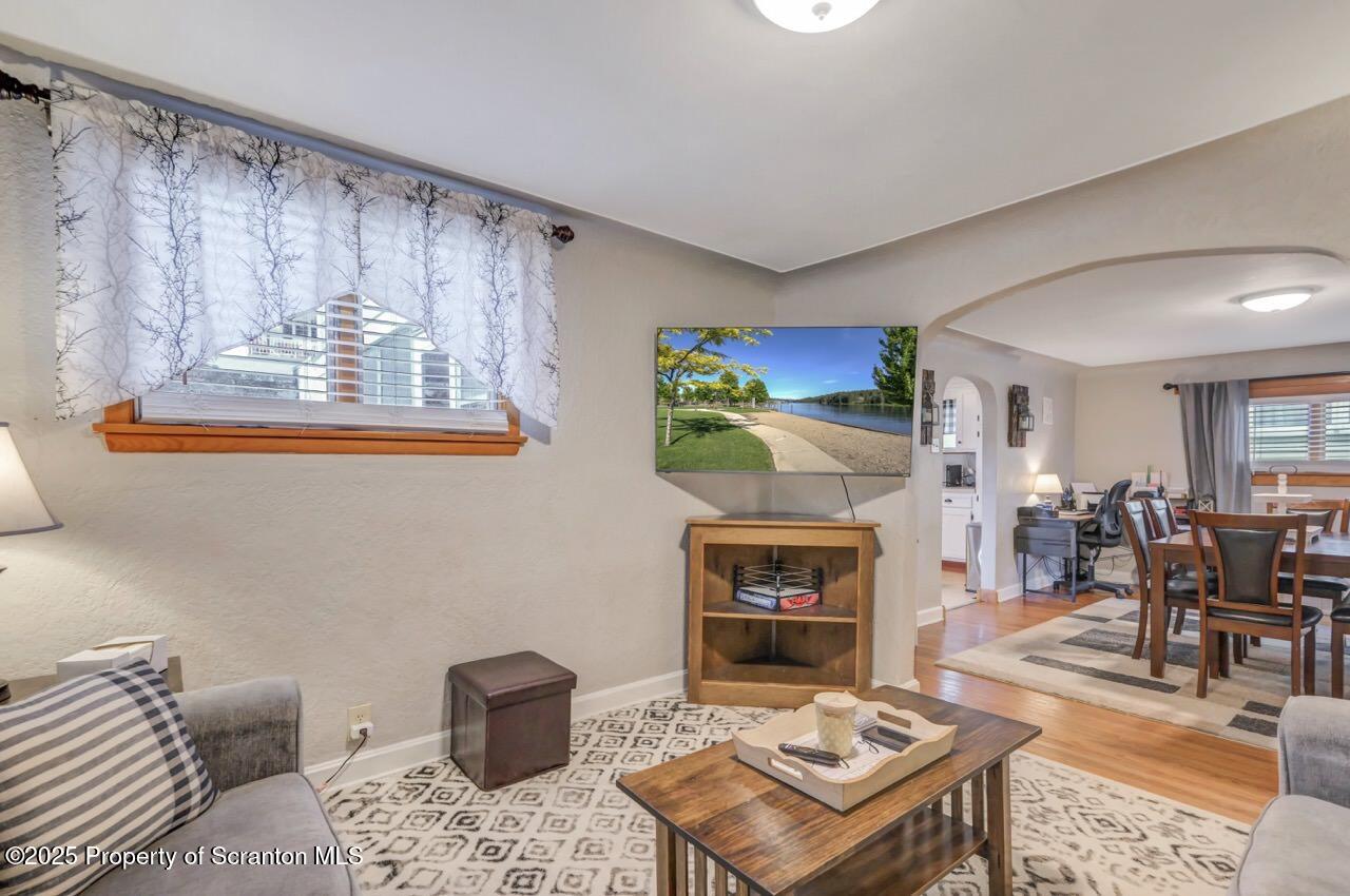 167 Handley Street Eynon, PA 18403 - Photo 7 of 48 a living room with furniture and a fireplace