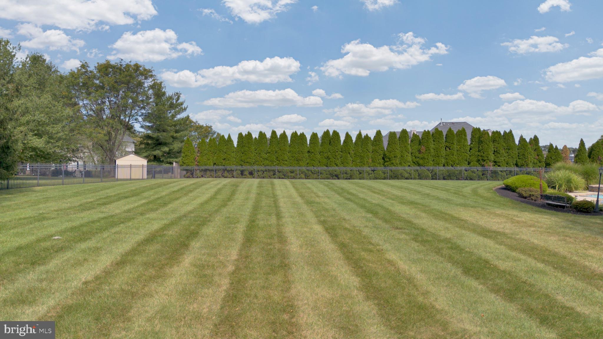 112 South Mennonite Road Collegeville, PA 19426 - Photo 107 of 131 Spacious lawn under a bright sky.