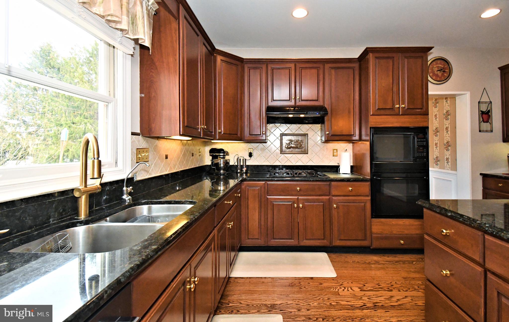 112 South Mennonite Road Collegeville, PA 19426 - Photo 29 of 131 Elegant kitchen with rich wood tones.
