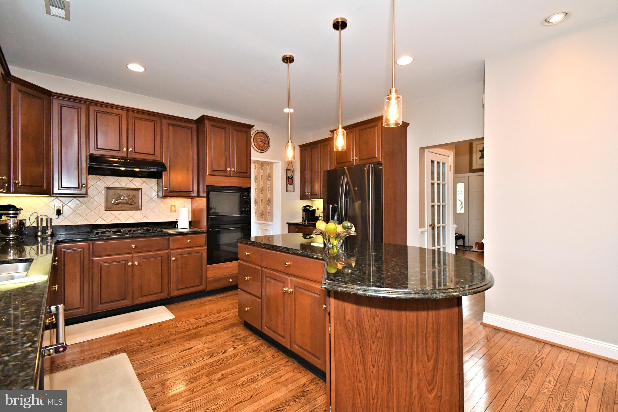 112 South Mennonite Road Collegeville, PA 19426 - Photo 30 of 131 Warm wood tones in a modern kitchen.