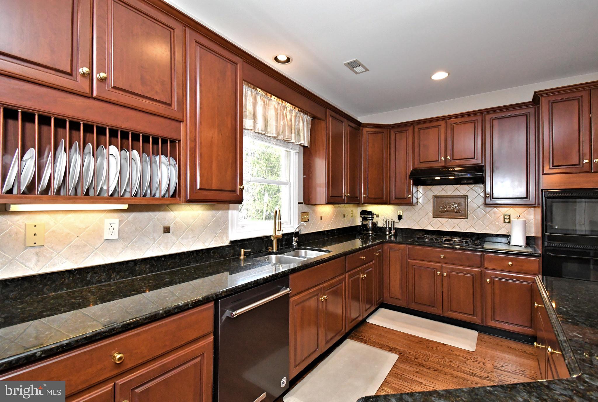 112 South Mennonite Road Collegeville, PA 19426 - Photo 31 of 131 Elegant kitchen with rich wood tones.