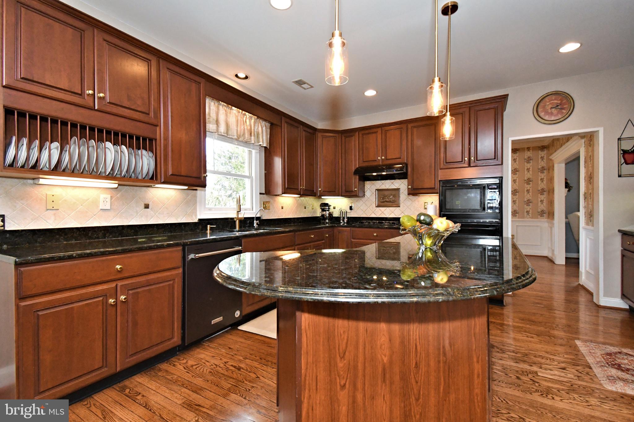 112 South Mennonite Road Collegeville, PA 19426 - Photo 32 of 131 Elegant kitchen with rich wood tones.