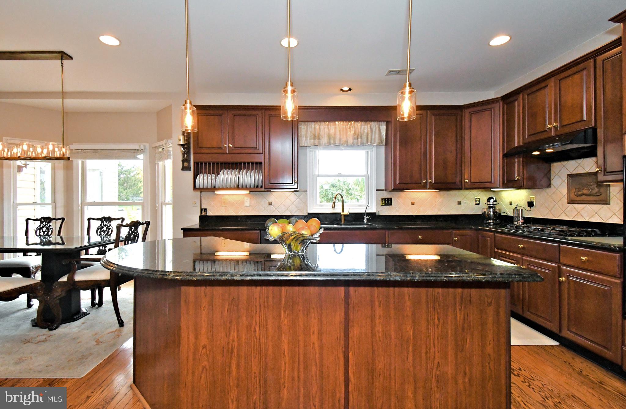 112 South Mennonite Road Collegeville, PA 19426 - Photo 33 of 131 Elegant kitchen with rich wood tones.